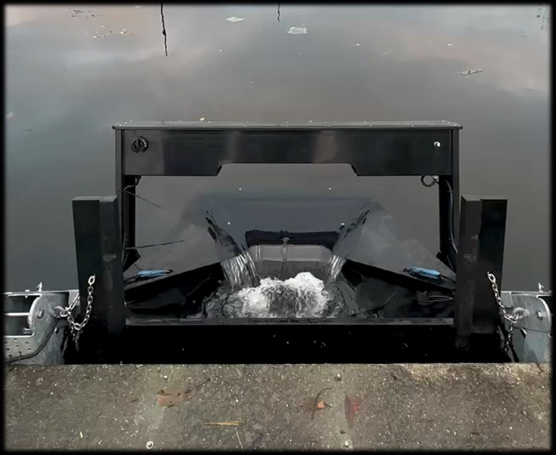 Aquapod intercepting floating pollution at a marina